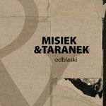 Czarny napis Misiek & Taranko na tle szarego kartonu.